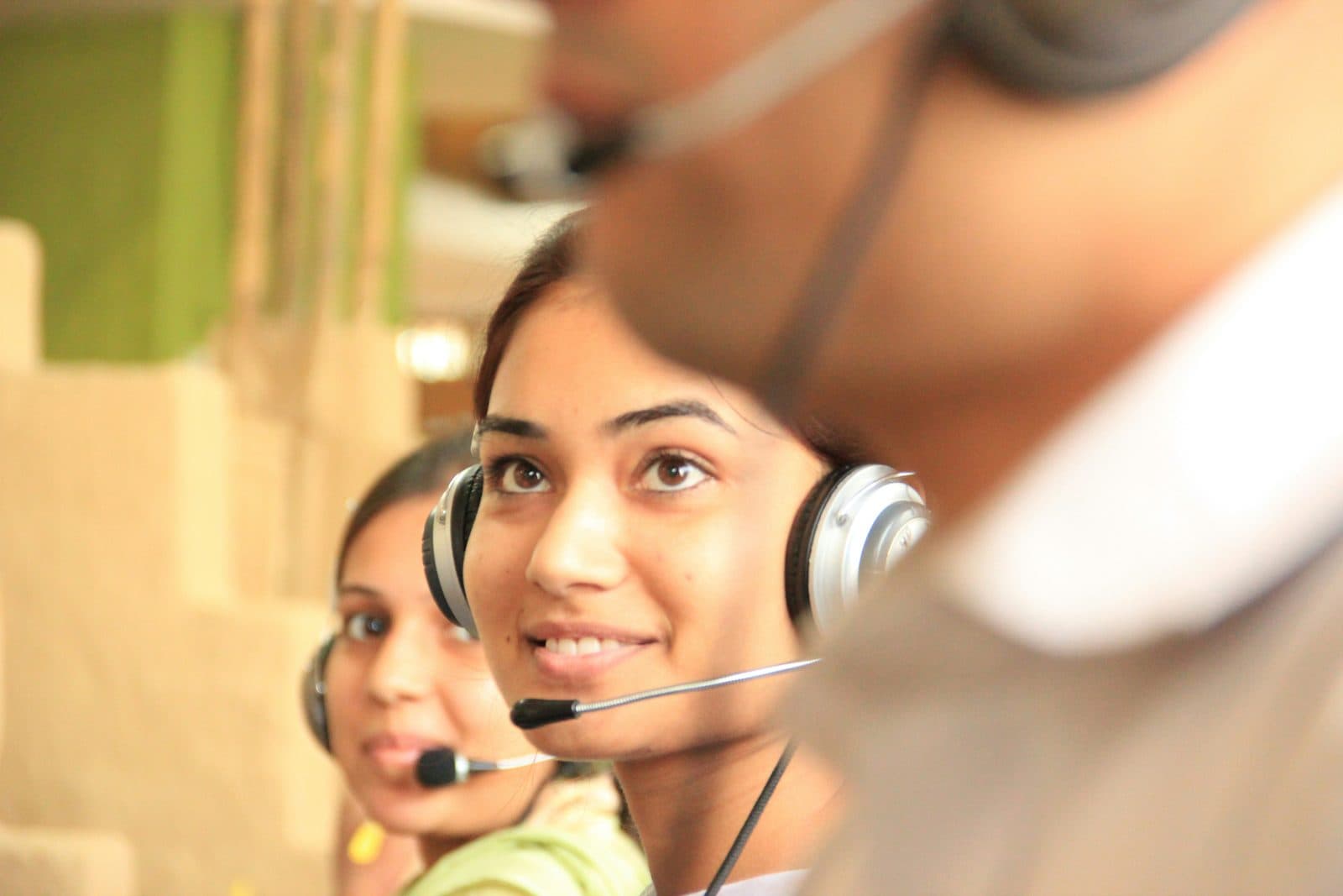A call-centre agent wearing a headset — HSA Group’s service businesses